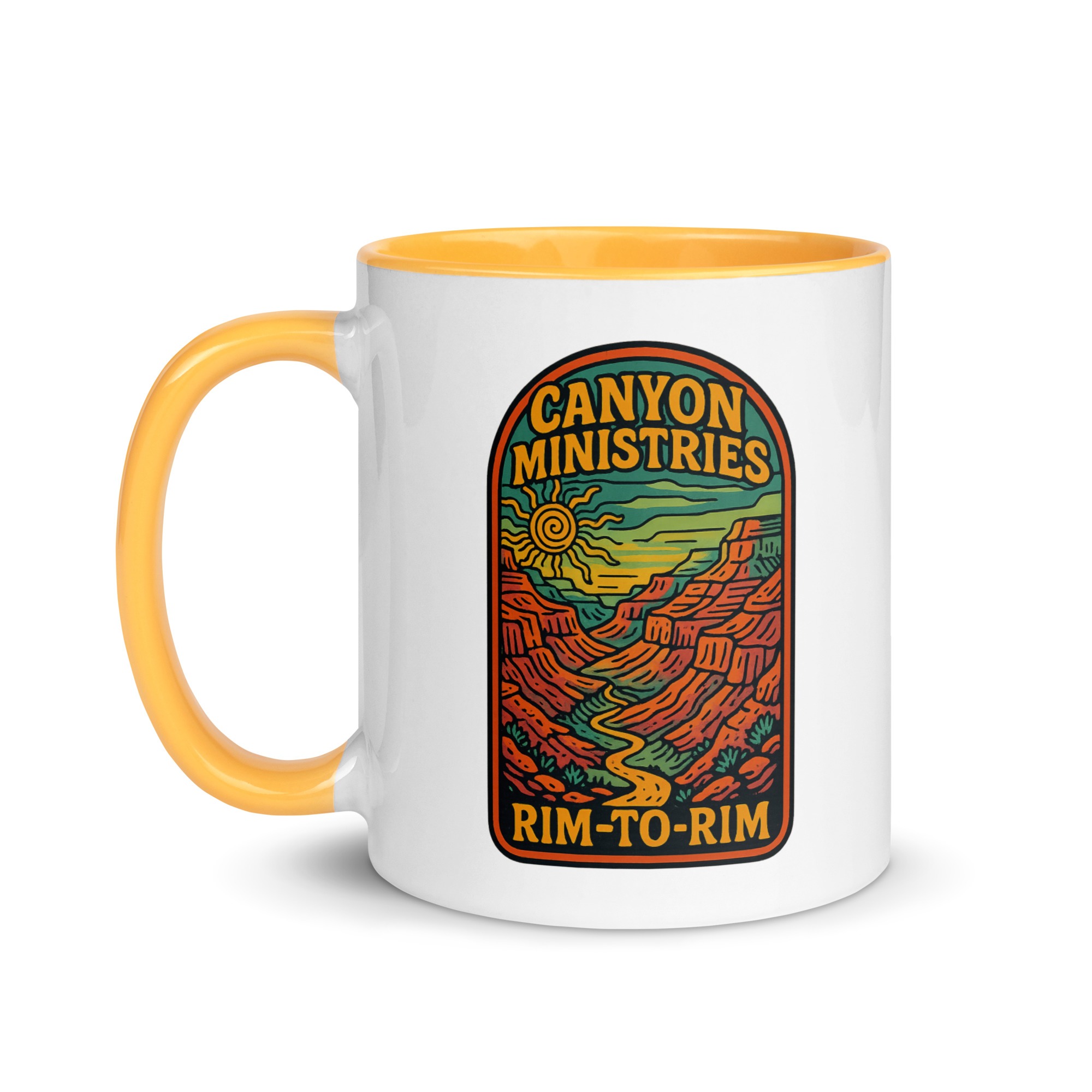 The Mug with Color Inside has a yellow handle and rim, displays a colorful canyon landscape graphic, and features the Canyon Ministries Rim-to-Rim text, bringing a vibrant and distinctive element to your drinkware collection.