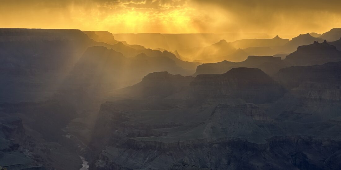 Golden sunset over the Grand Canyon and Colorado River photographed by Nate Loper