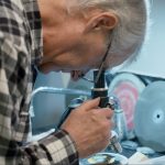 Ray Strom Looking Through Microscope