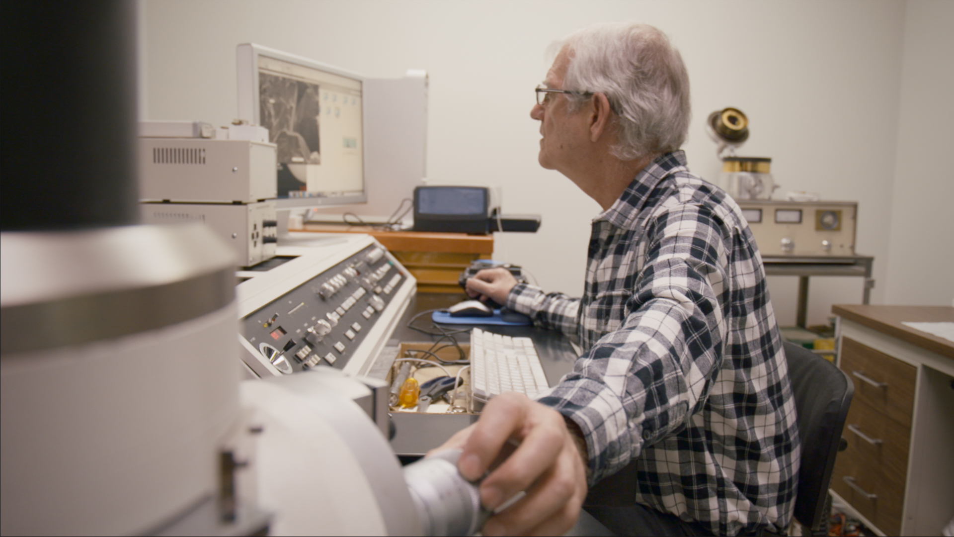 Ray Strom looking at Scanning Electron Microsope Images